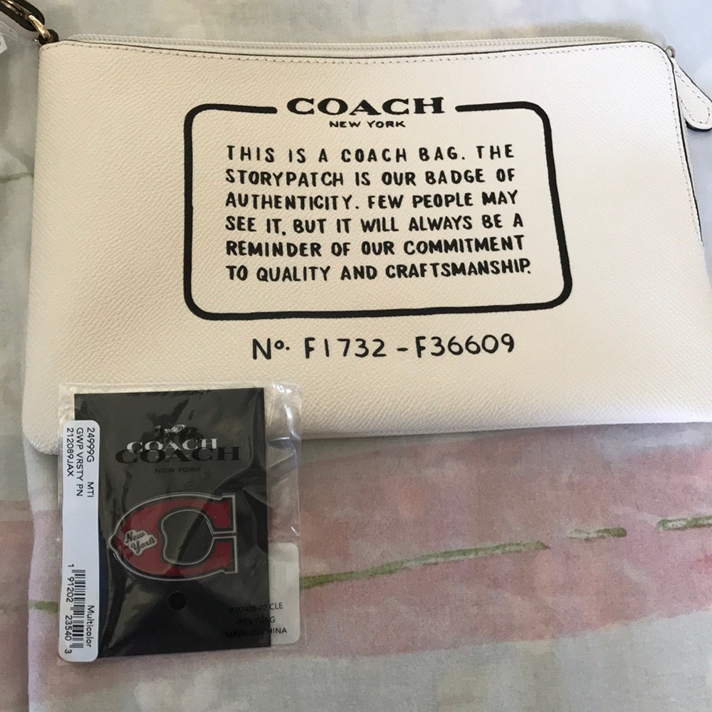 Coach pochette and pin